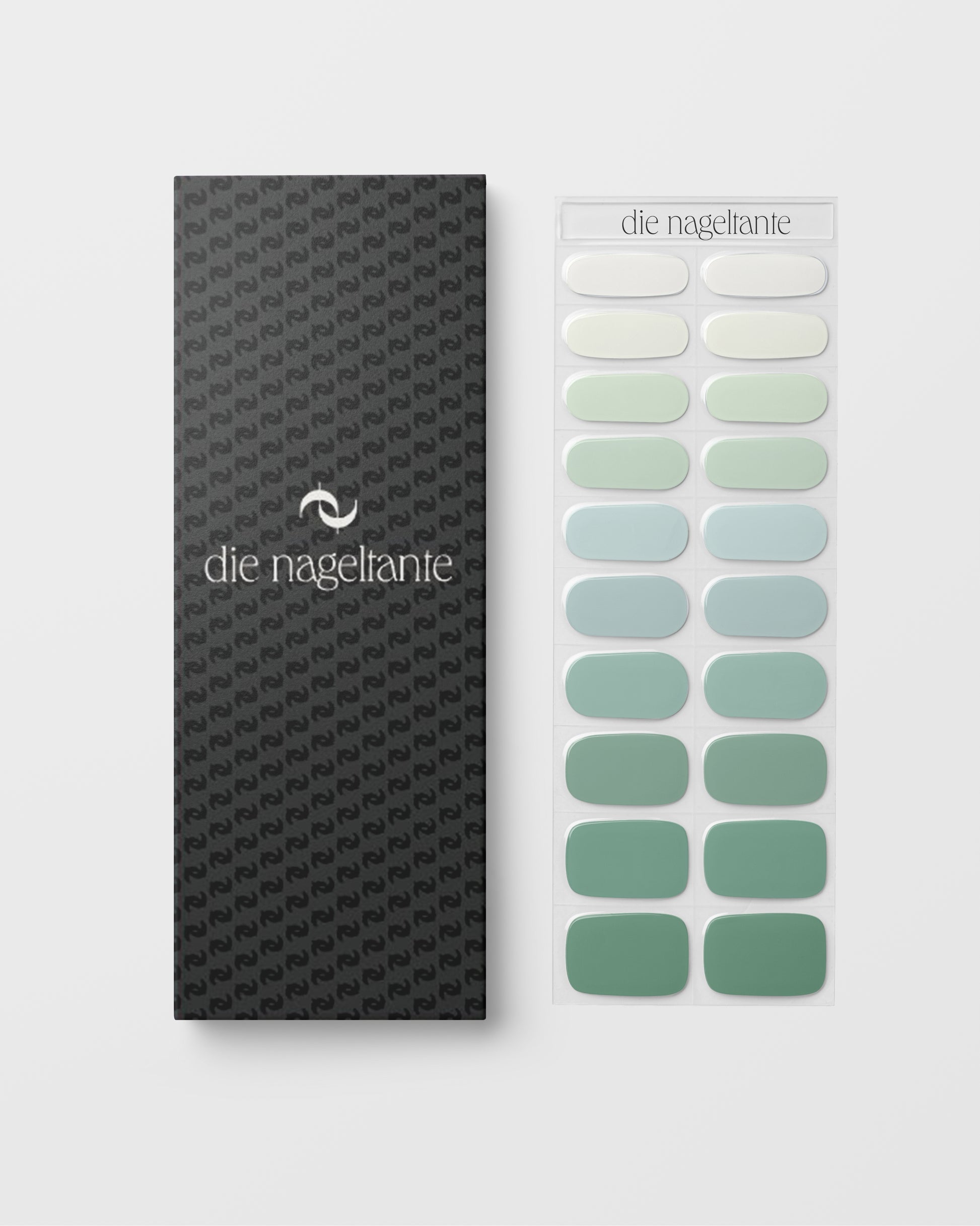 Detailaufnahme – sanfte Grüntöne und Cremeweiß in harmonischem Farbverlauf für gepflegte Nägel.
