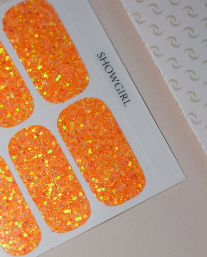 Showgirl Nailpolish Wraps in Orange-Gold-Glitzer – Produktfoto in Verpackung von Die Nageltante