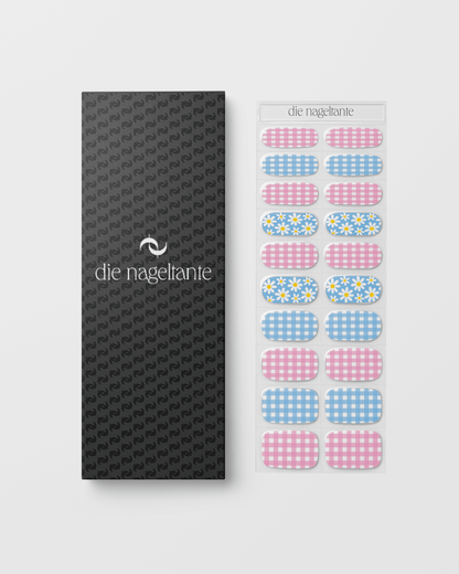 Verpackung der Tausendschön Nailpolish Wraps mit Übersicht der enthaltenen Pastell-, Blumen- und Vichy-Karo-Designs.